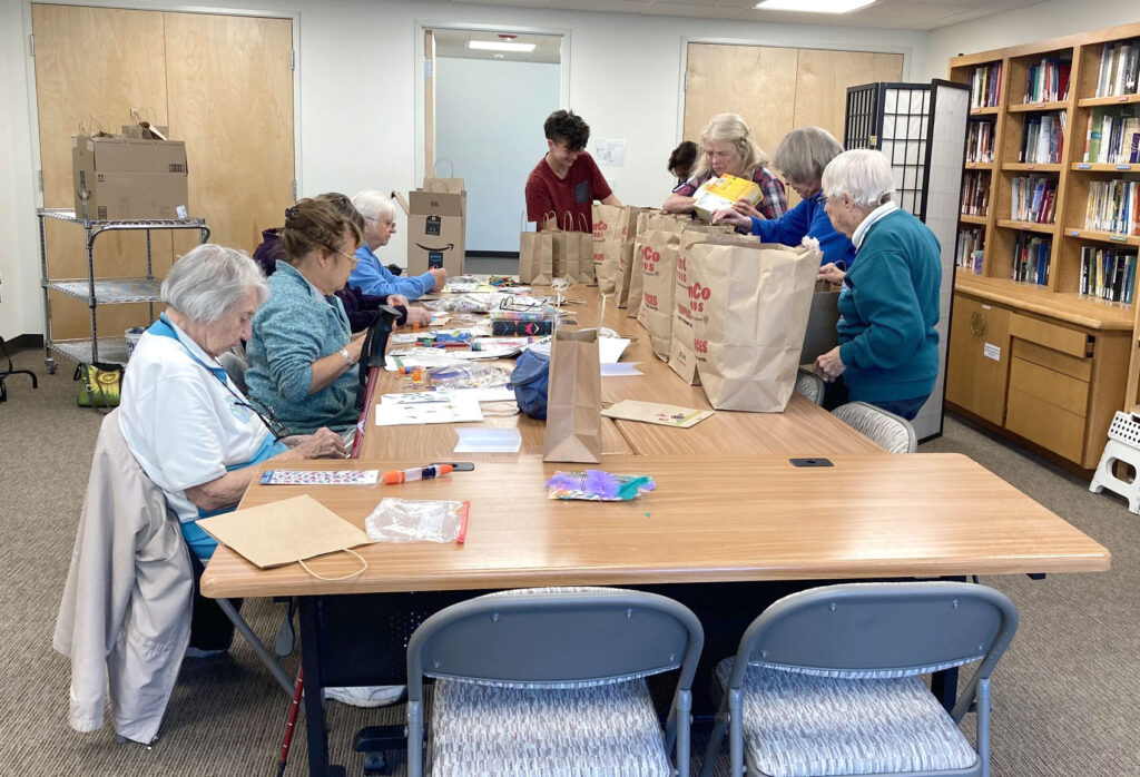 Wholly Crones group assembling Comfort Kits for Planned Parenthood in Pullman