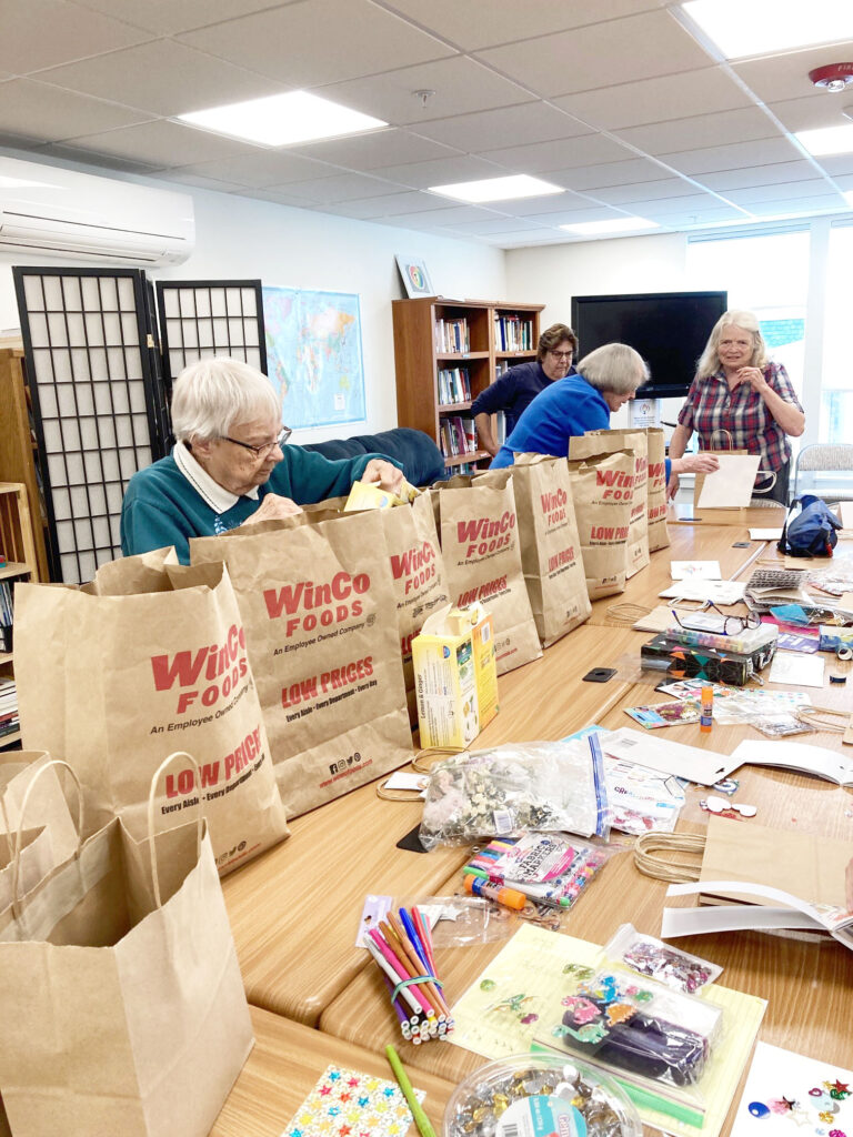 Wholly Crones group assembling Comfort Kits for Planned Parenthood in Pullman